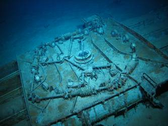 Quadruple torpedo tube mount on seabed - roller bearings visible
